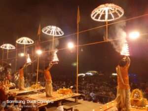 Men Performing Ganga aarti with Diya's in Varanasi