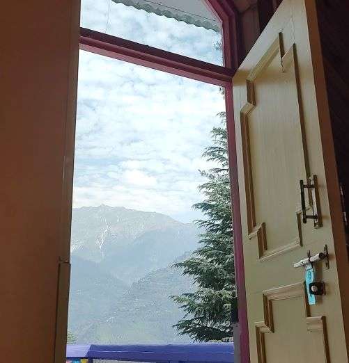 Open door and giving Manali mountain view