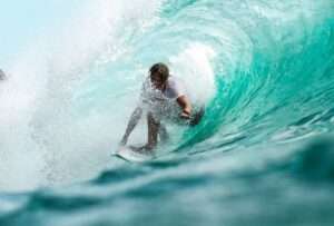 Tourist doing surfing at serenity beach in pondicherry which is one of the best place to visit