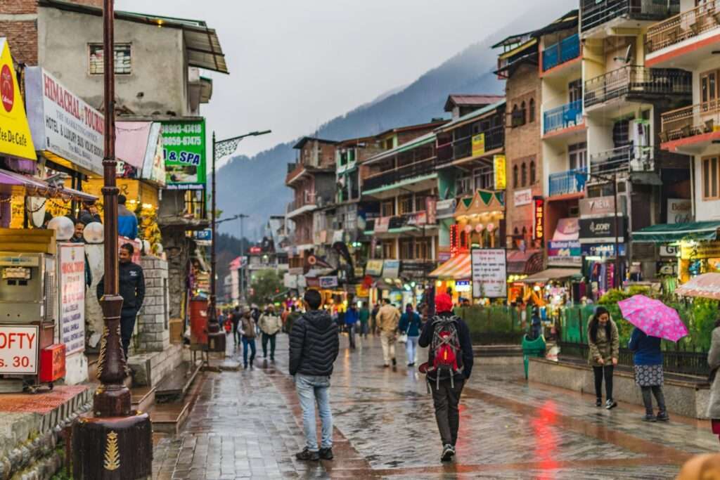 Mall road, manali, people wear sweater, jackets, in Manali in december