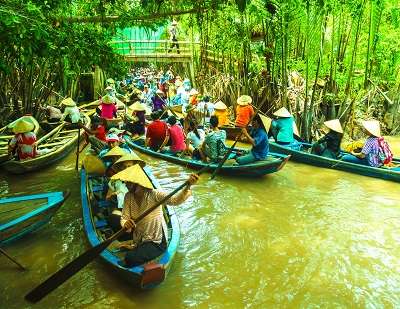 Boats rowing in Mekong River Delta making it best destination in Vietnam