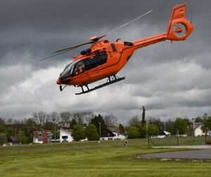 helicopter landing over plane land