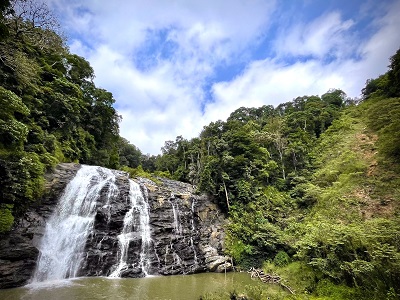 Abbey waterfalls in the middle of the lush green rocky places in Coorg