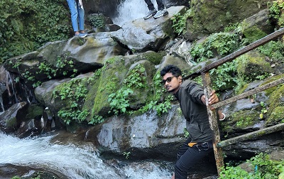 Man wearing sunglasses at the best tourist spots in Sikkim that is Rock Garden