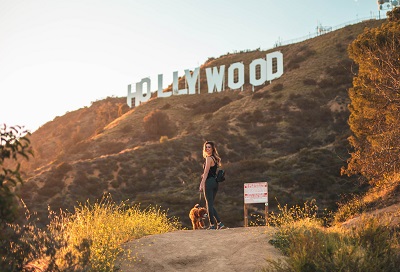 A hiker women with her dog On hiking trip at Hollywood Sign