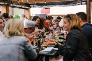 tourists dining in a restaurant trying not to look like a tourist in Paris