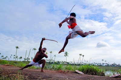 Kalari fighters attacking each others during a fight show in Munnar