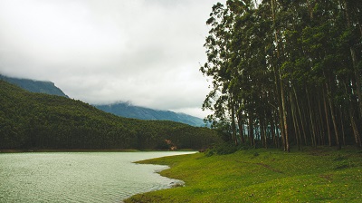 Serene and calm location on a lake side amidst lush green mountains and dense forests