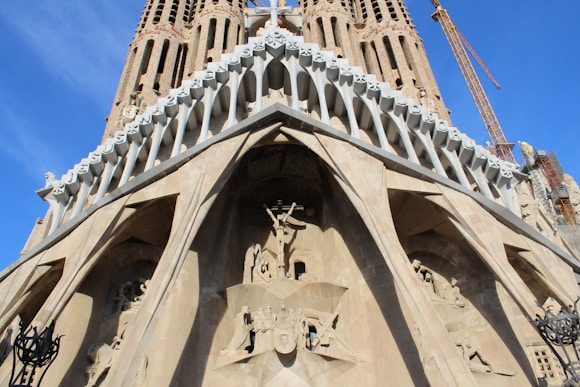 brown concrete building named sargada familia is one of the best places in Barcelona